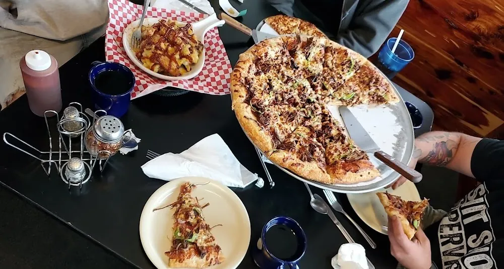 Pulled Pork Potato Topped with Mac N Cheese and BBQ Brisket Pizza